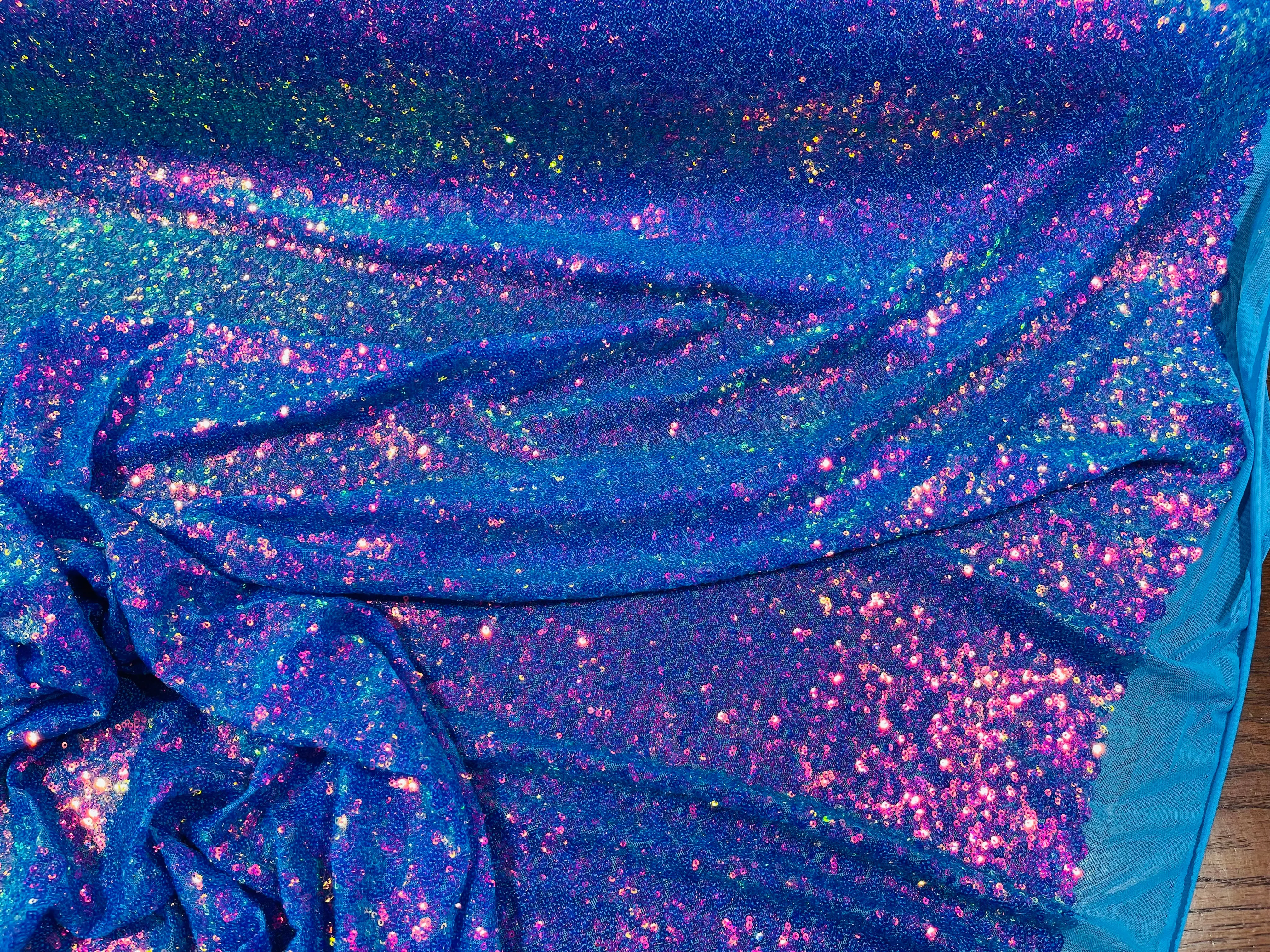 Purple Iridescent Mini Glitz Sequins on a Turquoise 4 Way Stretch Mesh-Sold By The Yard.